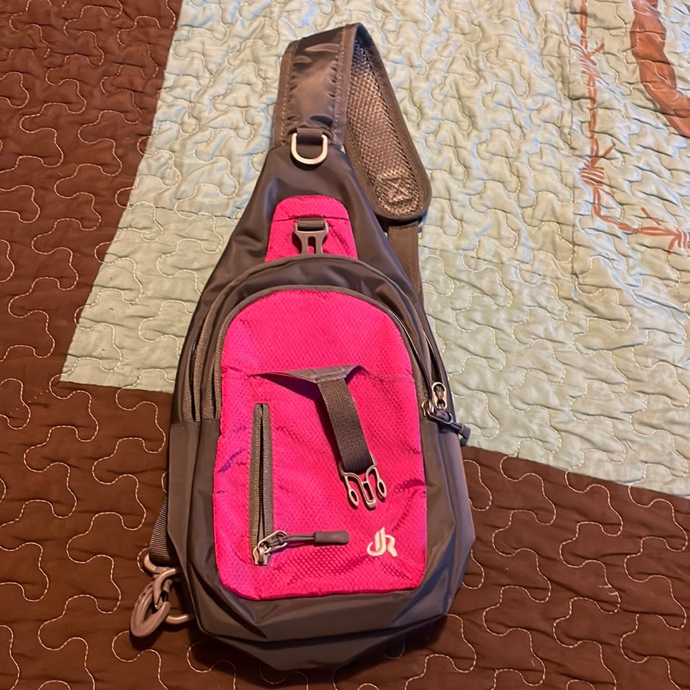 Crossbody backpack shoulder bag NEW never used without tags right/left shoulder